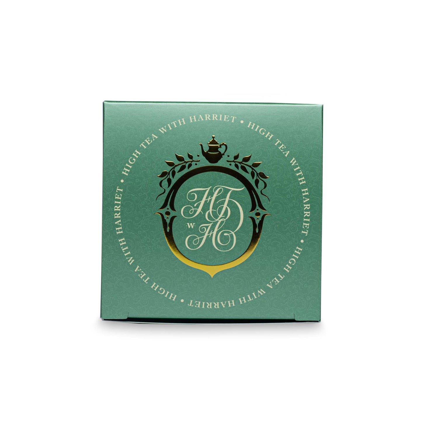 Top view of High Tea with Harriet Christmas Tea box with festive red and green colour scheme and gold crest logo
