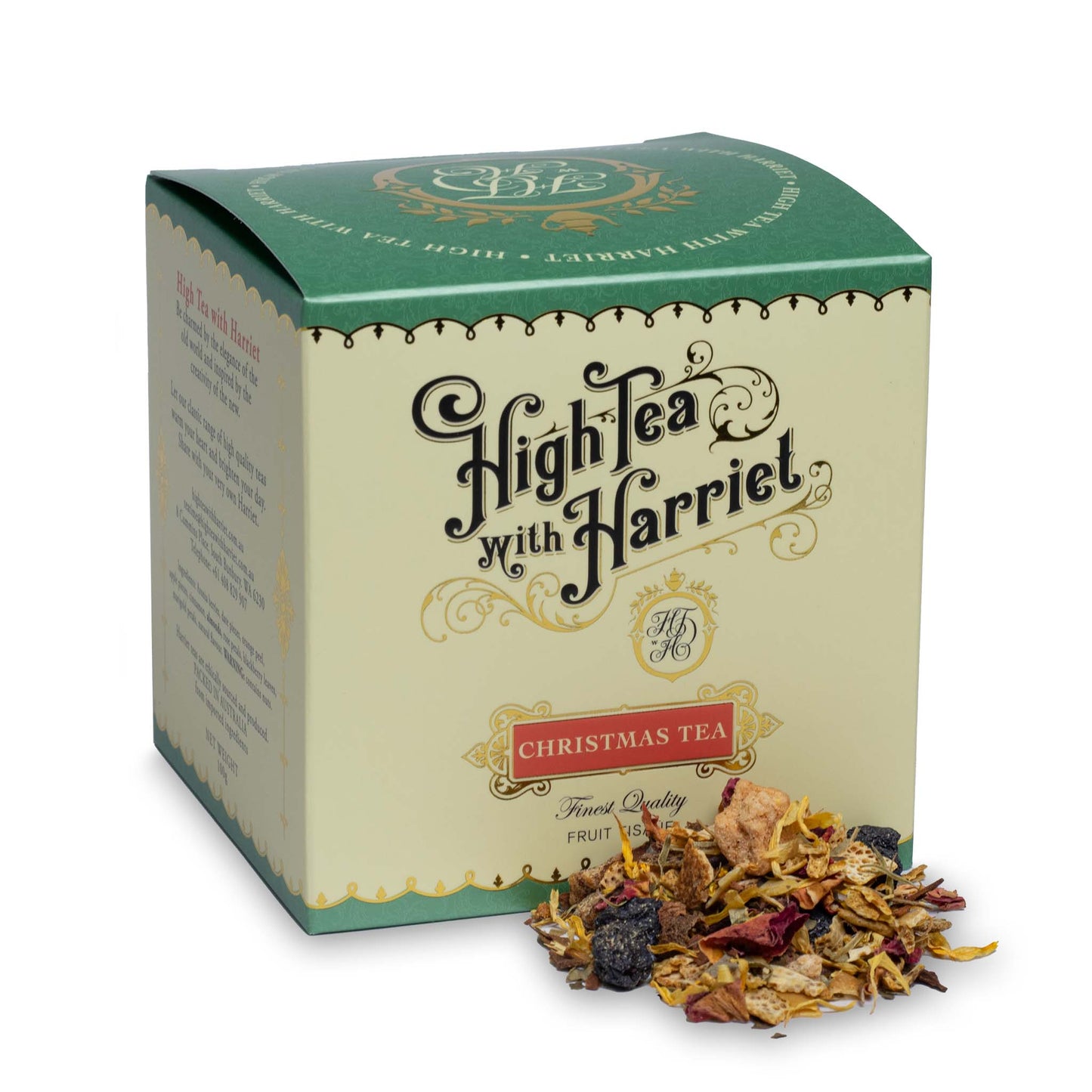 High Tea with Harriet Christmas Tea in festive green box with red label, shown with loose fruit tisane featuring berries, citrus, and spices