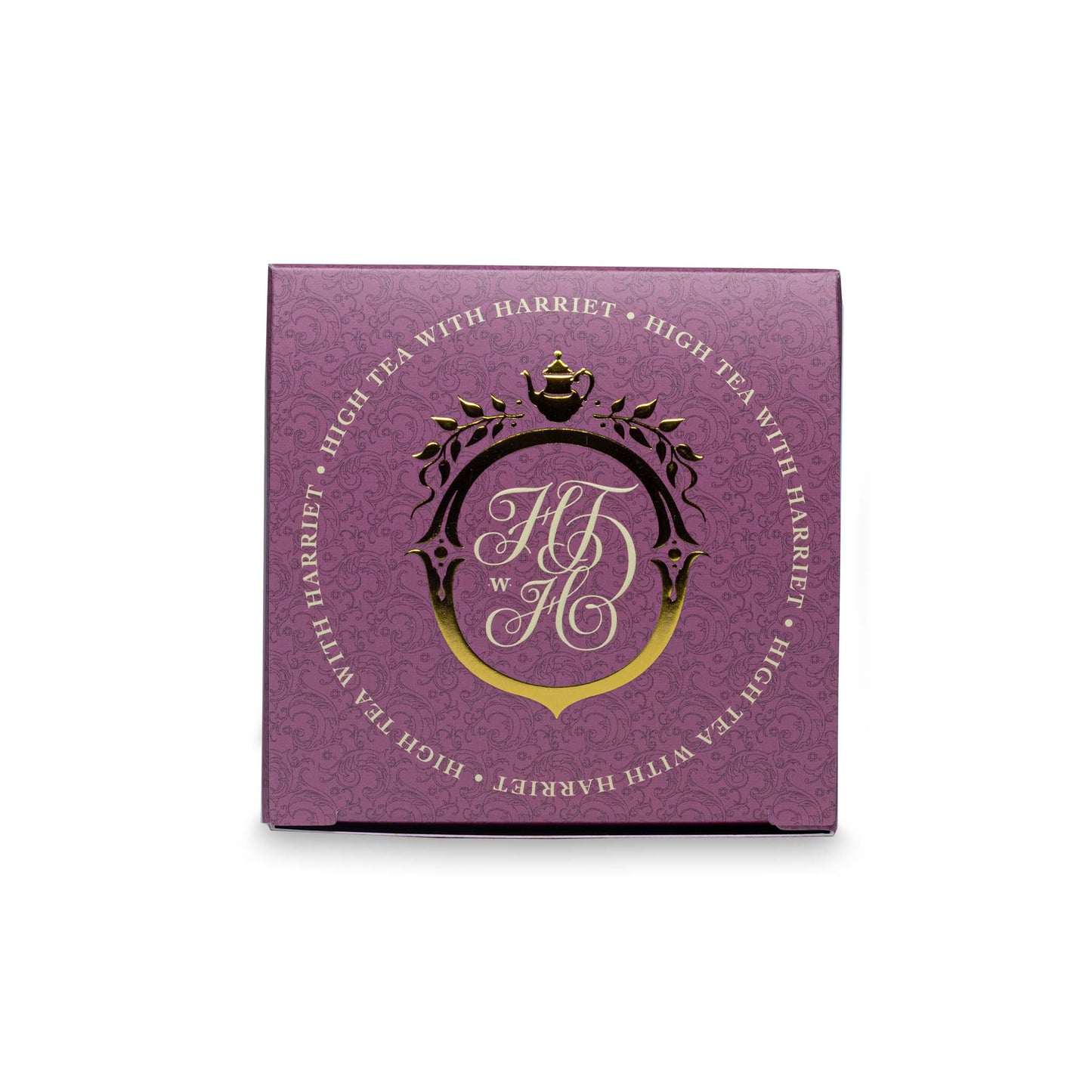 Top view of High Tea with Harriet Duchess of Bedford tea box in mauve with gold crest and branding details