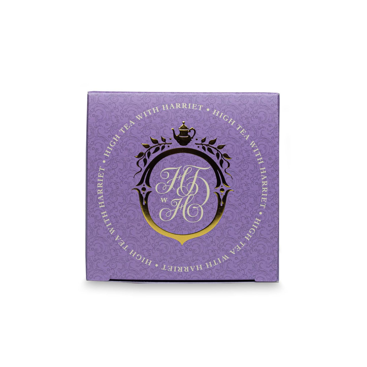 Top view of High Tea with Harriet French Earl Grey tea box in lavender with gold crest and branding