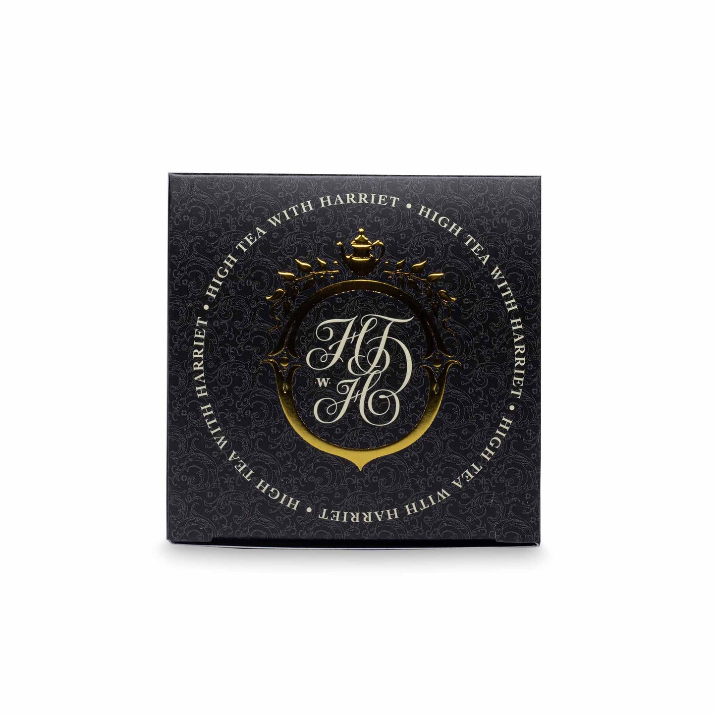 Top view of High Tea with Harriet Melbourne Moments tea box in matte black with gold crest and minimalistic styling