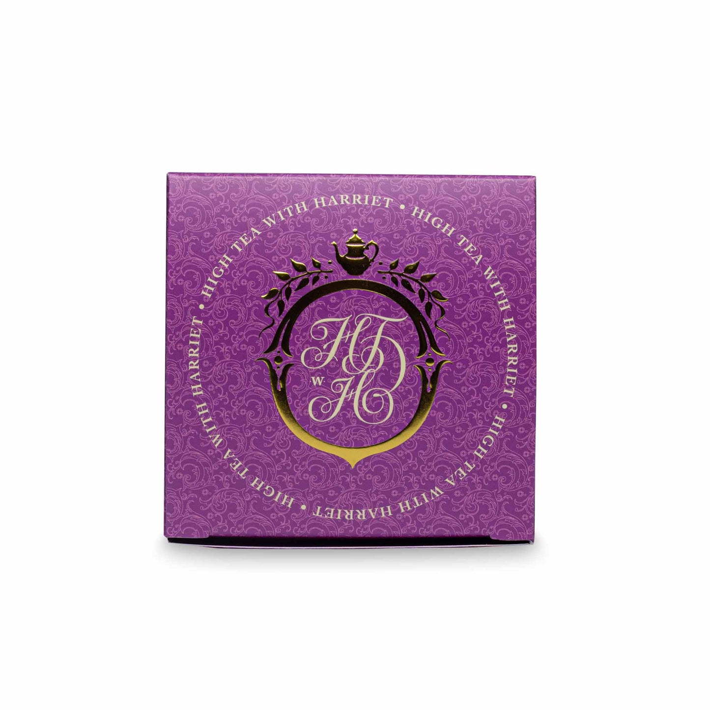 Top view of High Tea with Harriet Monsoon Moon box in purple with crest logo