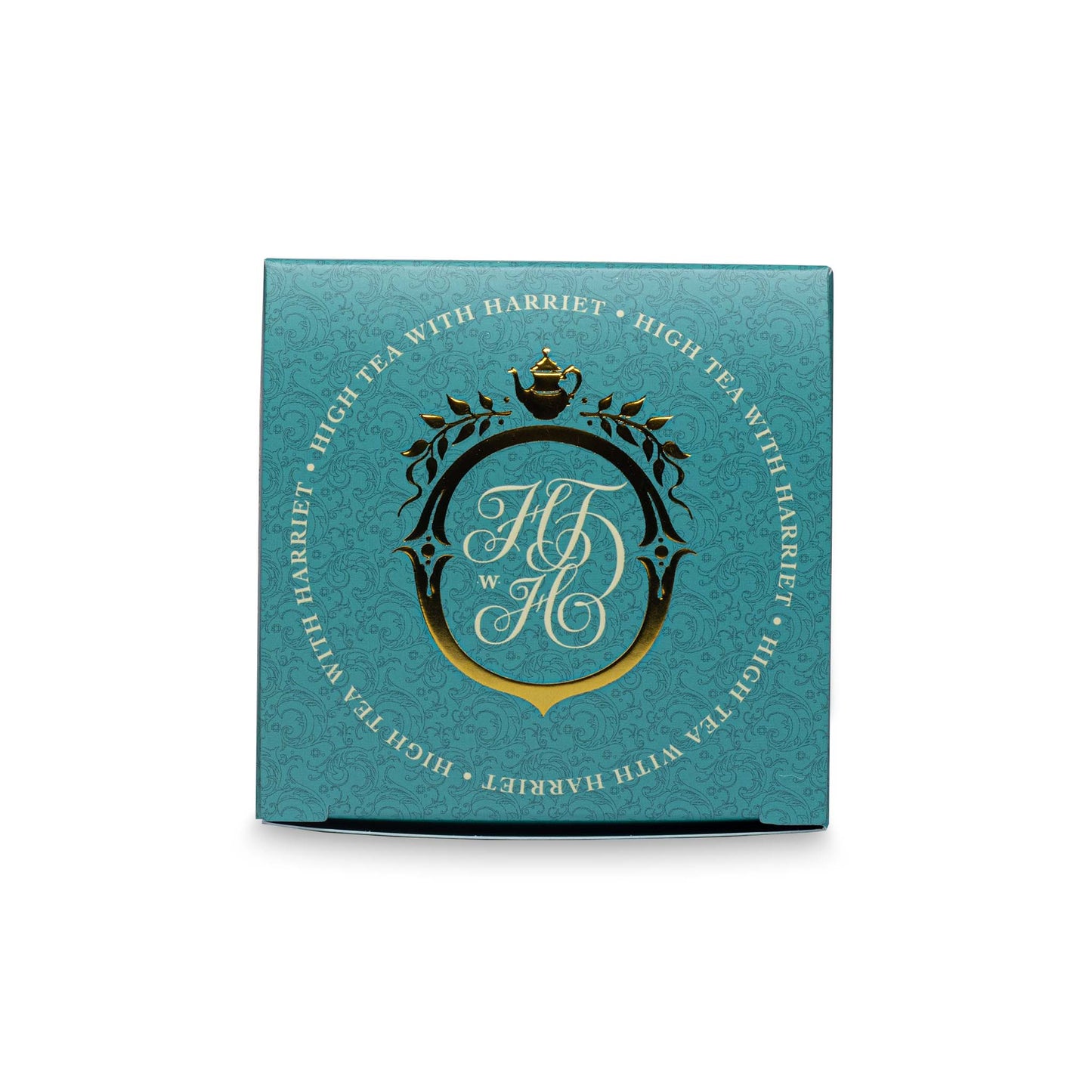 Top view of High Tea with Harriet Moroccan Mint tea box in teal and gold with crest logo