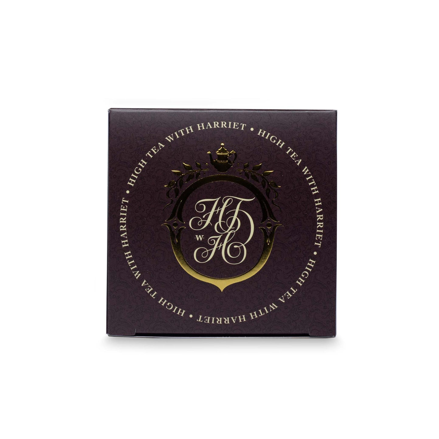 Top view of High Tea with Harriet Utterly Charming Chai box in deep brown with gold crest logo