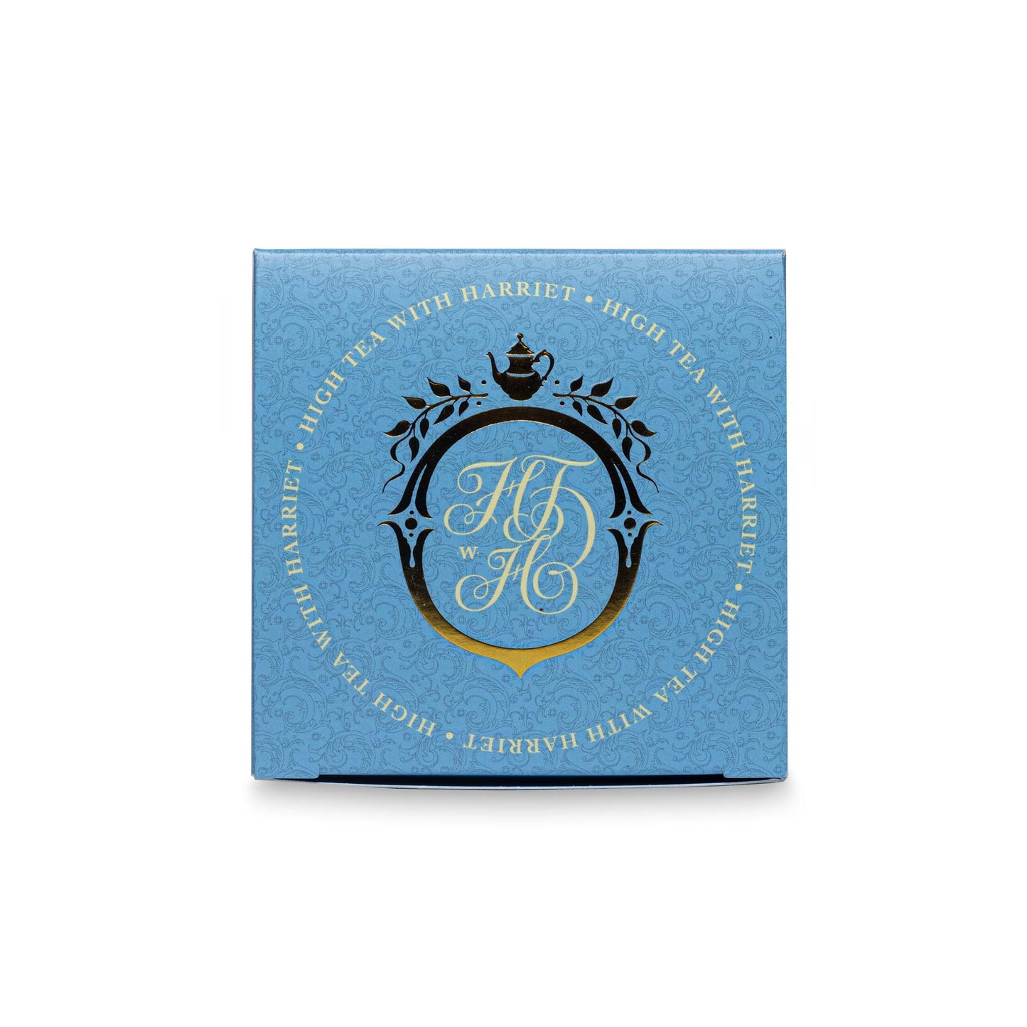 Top view of High Tea with Harriet White Night box in sky blue with gold and black crest and branding