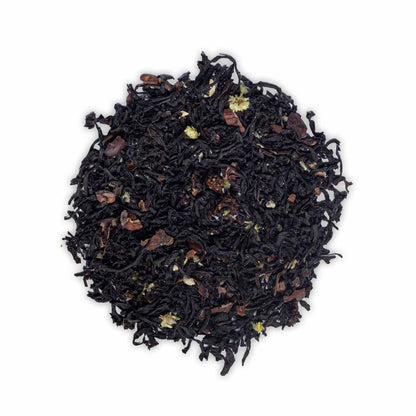 Loose leaf Birthday Tea by High Tea with Harriet featuring black tea, cacao pieces, and dried strawberry on white background