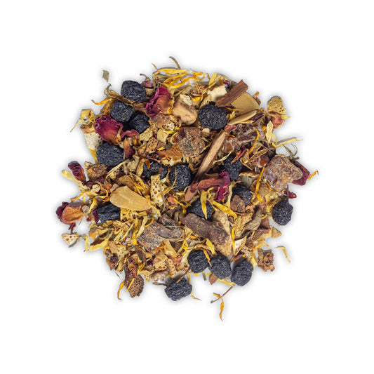 Loose leaf Christmas Tea by High Tea with Harriet featuring orange pieces, apple, cinnamon, almonds, berries, rose petals, and marigold blossoms