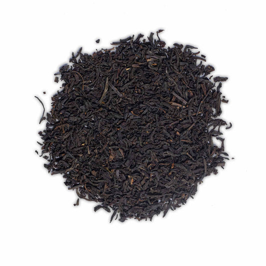 Loose leaf Earl Grey black tea by High Tea with Harriet featuring fine dark leaves on white background