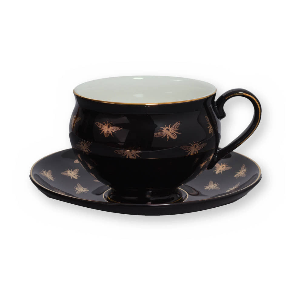 Fine bone china teacup, Black Bee design, on its saucer