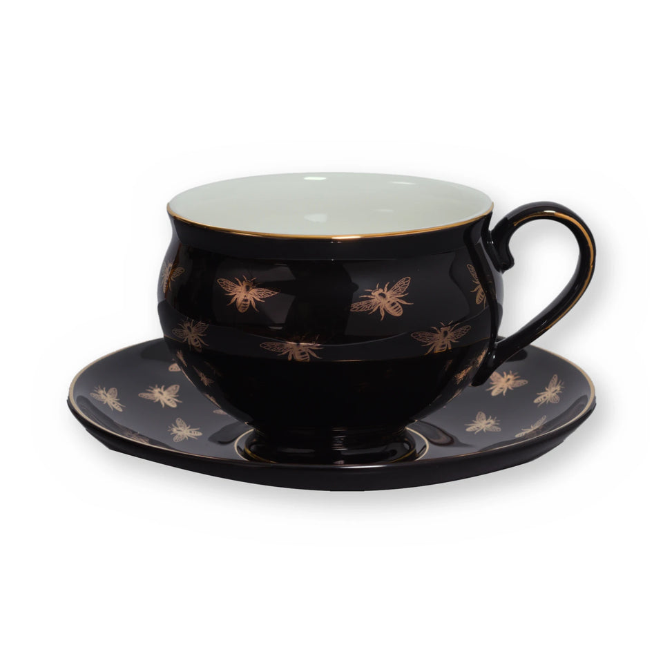 Fine bone china teacup, Black Bee design, on its saucer