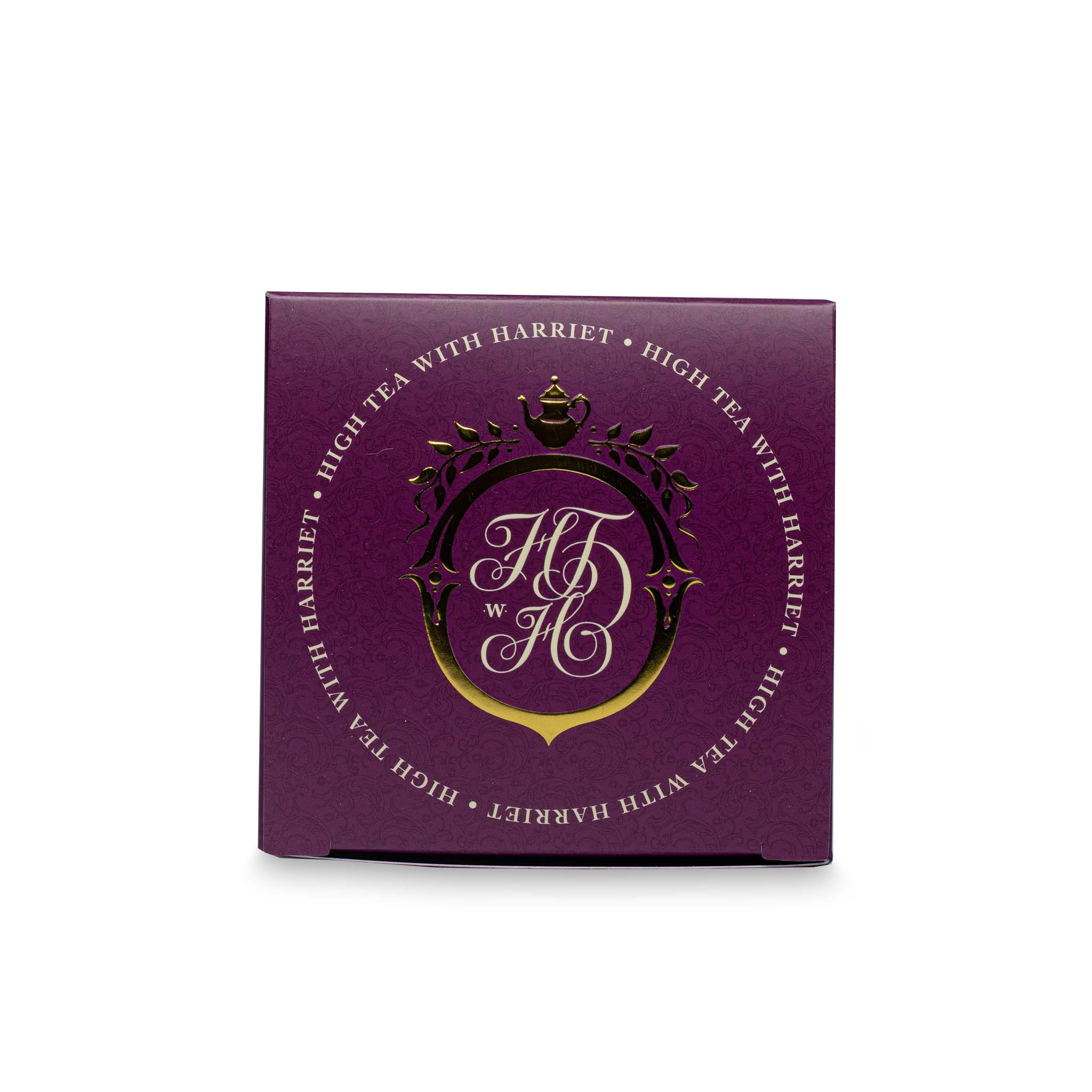Top view of High Tea with Harriet Birthday Tea box in deep red with gold crest logo