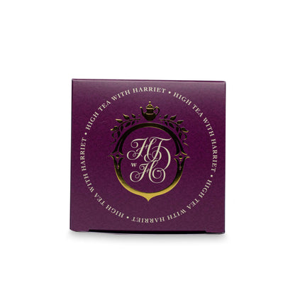 Top view of High Tea with Harriet Birthday Tea box in deep red with gold crest logo