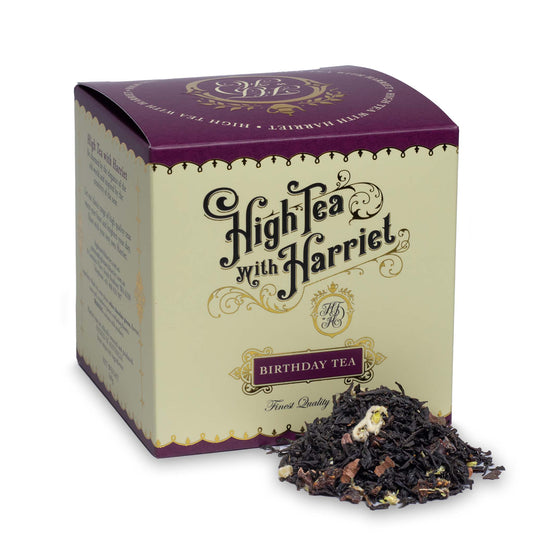 High Tea with Harriet Birthday Tea in elegant dark red box with loose leaf chocolate and strawberry tea blend in front