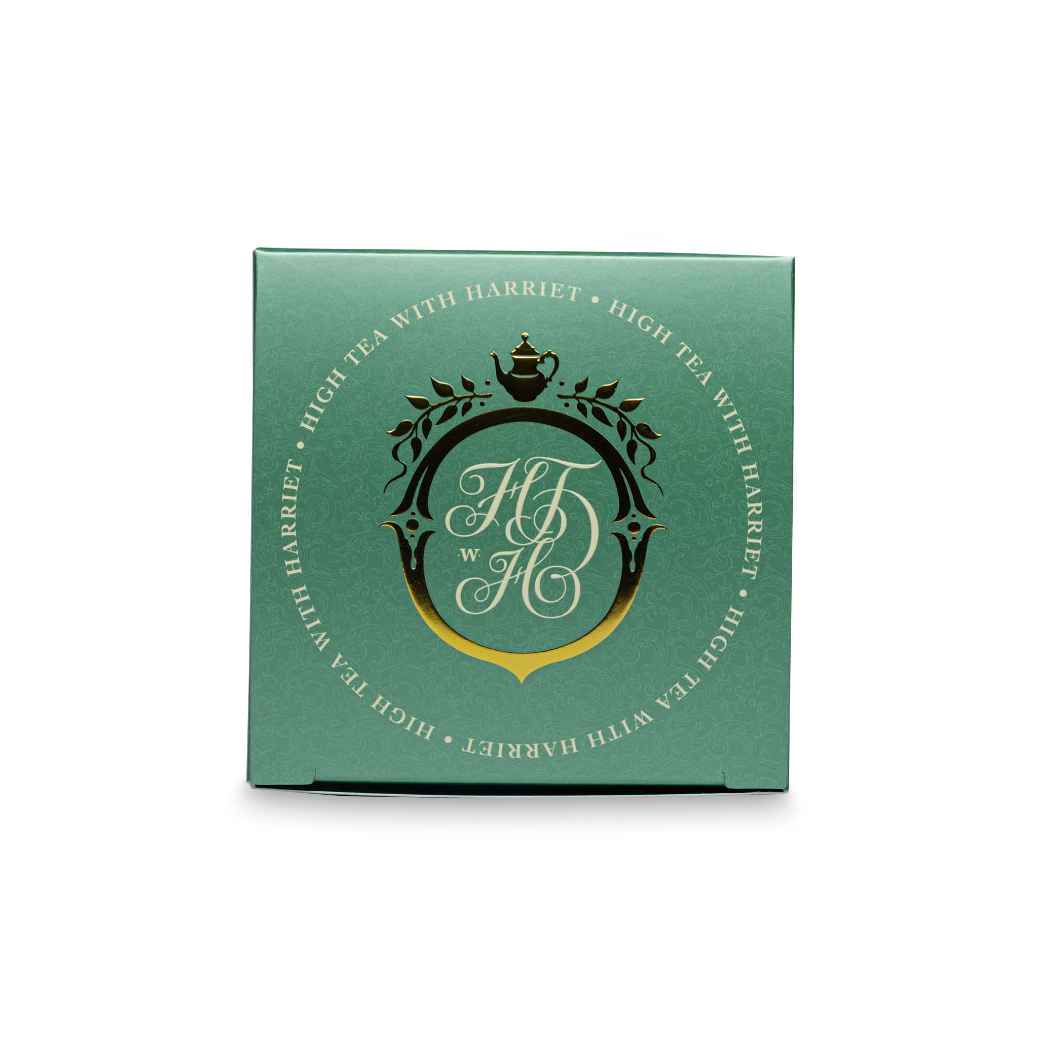 Top view of High Tea with Harriet Christmas Tea box with festive red and green colour scheme and gold crest logo