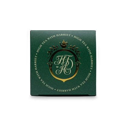 Top view of High Tea with Harriet Elevenses Irish Breakfast box in emerald green with gold crest and branding