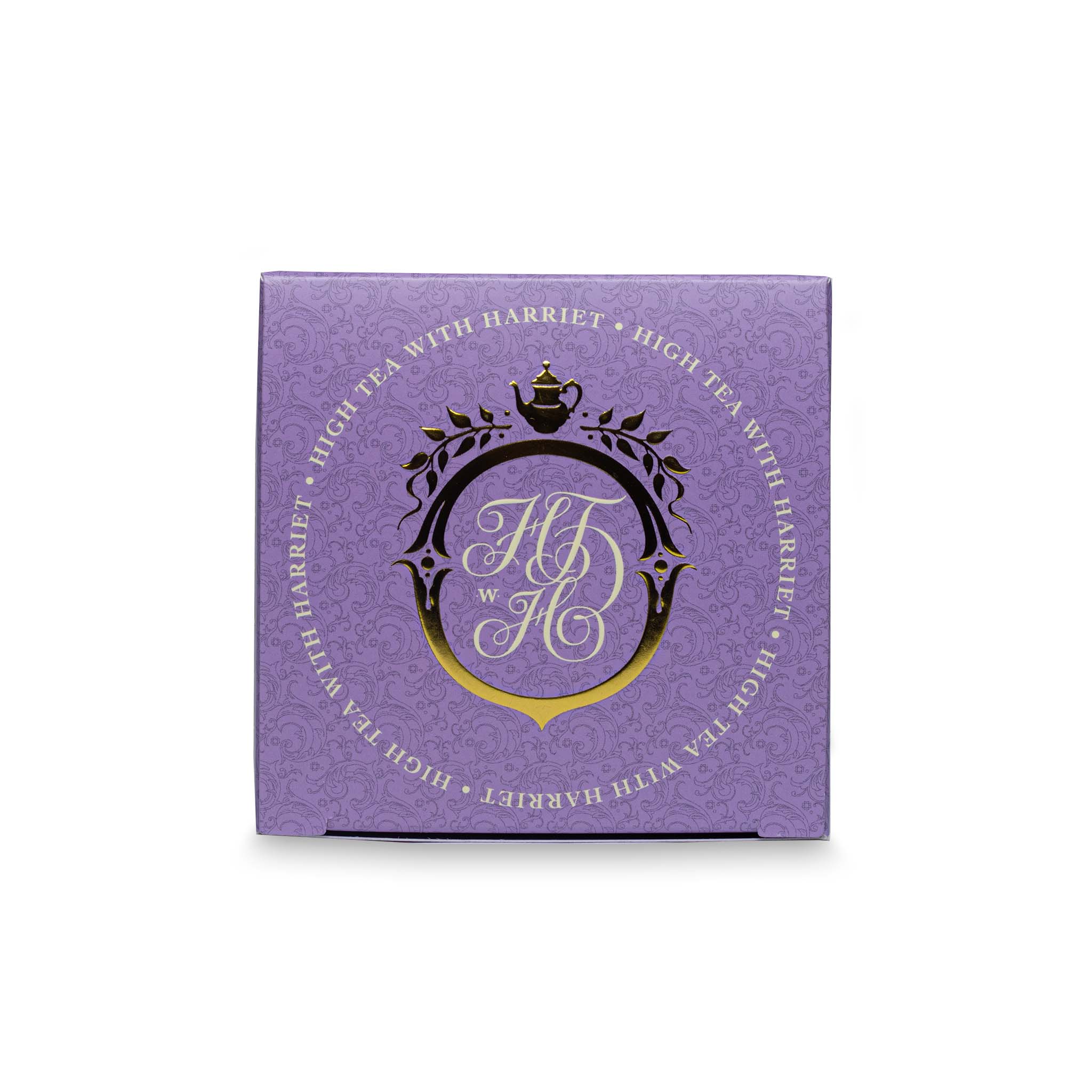 Top view of High Tea with Harriet French Earl Grey tea box in lavender with gold crest and branding