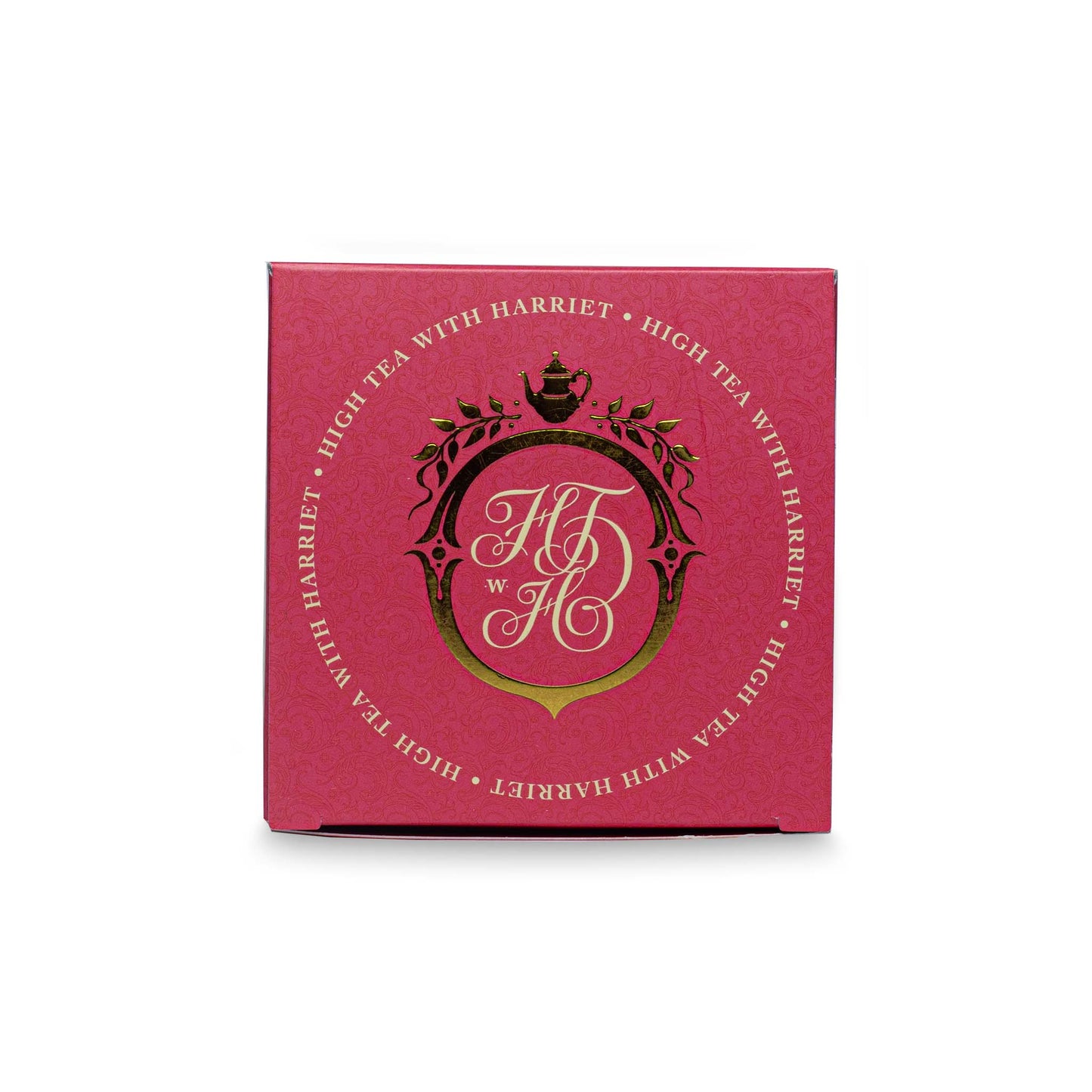 Top view of High Tea with Harriet Peach Blush tea box in pink with gold crest and branding