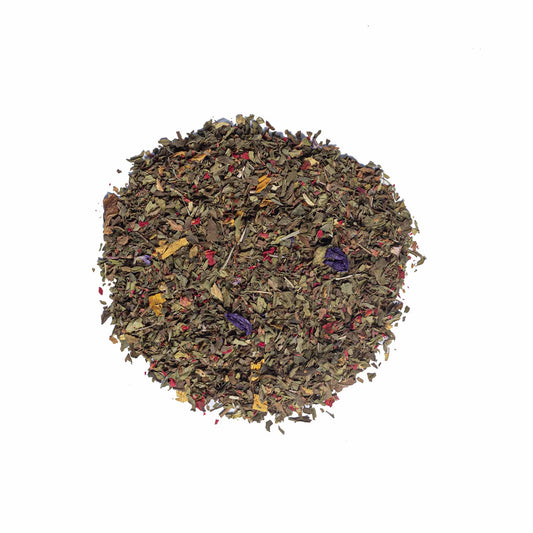 Loose leaf Moroccan Mint herbal tea by High Tea with Harriet featuring dried mint, petals, and herbs on white background