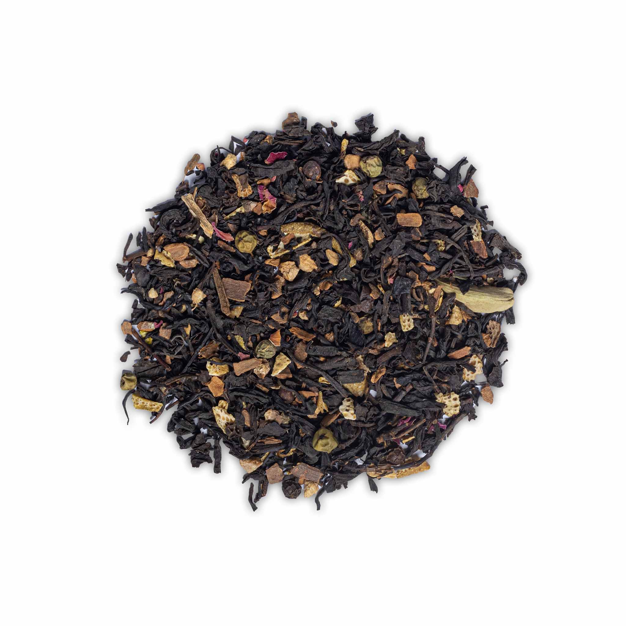 Loose leaf Utterly Charming Chai by High Tea with Harriet with visible spices, rose petals, and tea leaves on white background