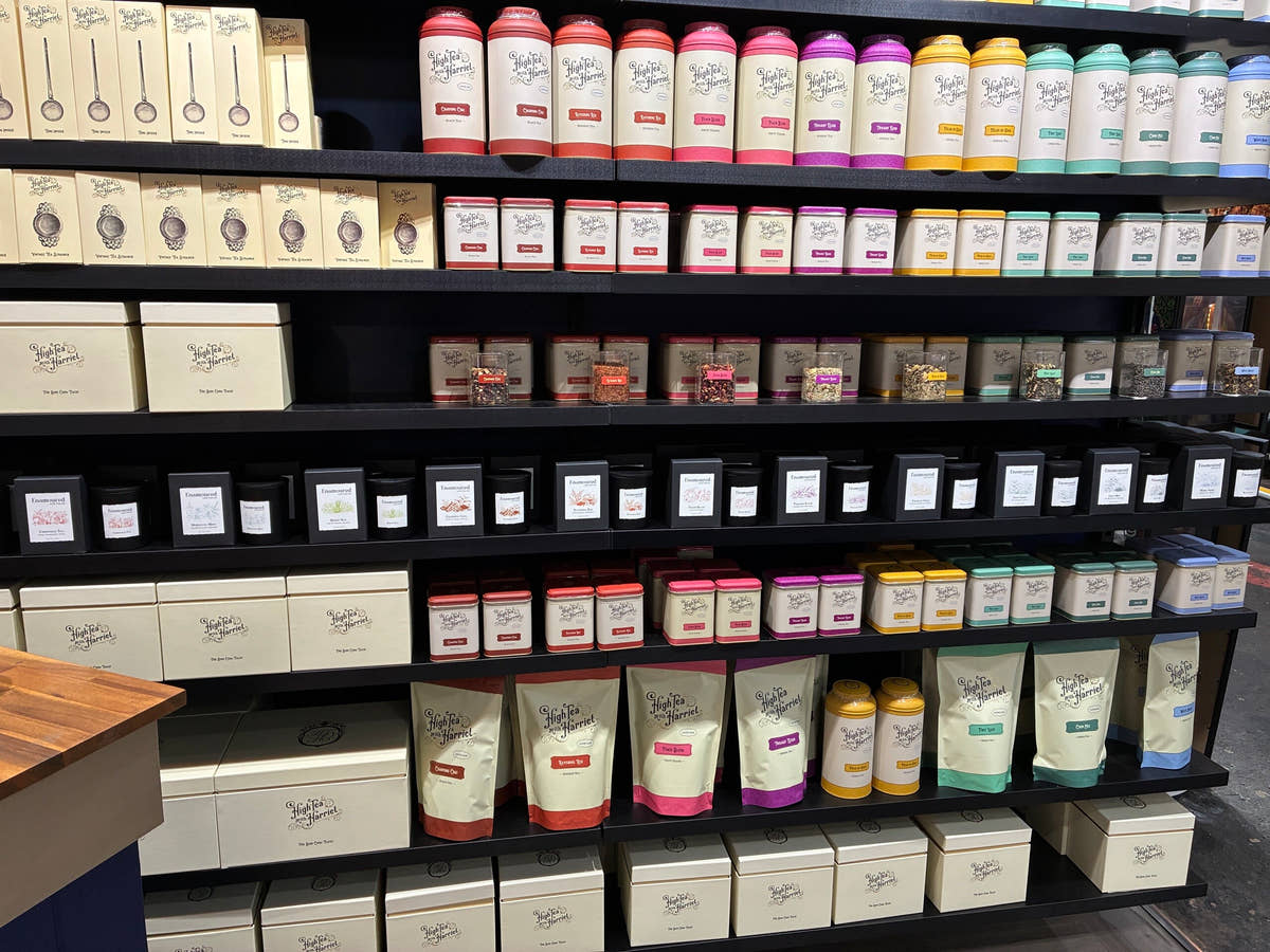 The High Tea with Harriet tea wall: shelves of tins, pouches and gift boxes